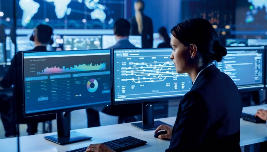 A female employee working inside a control room