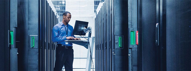 A person standing in a server room