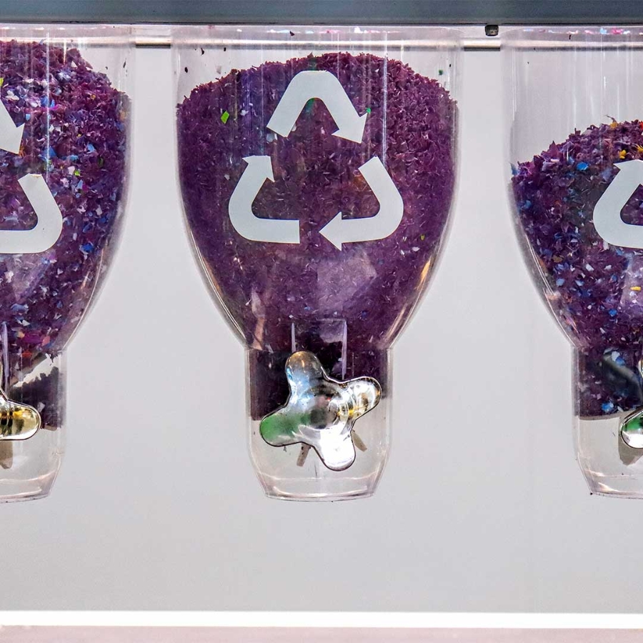 A group of clear containers with purple sand