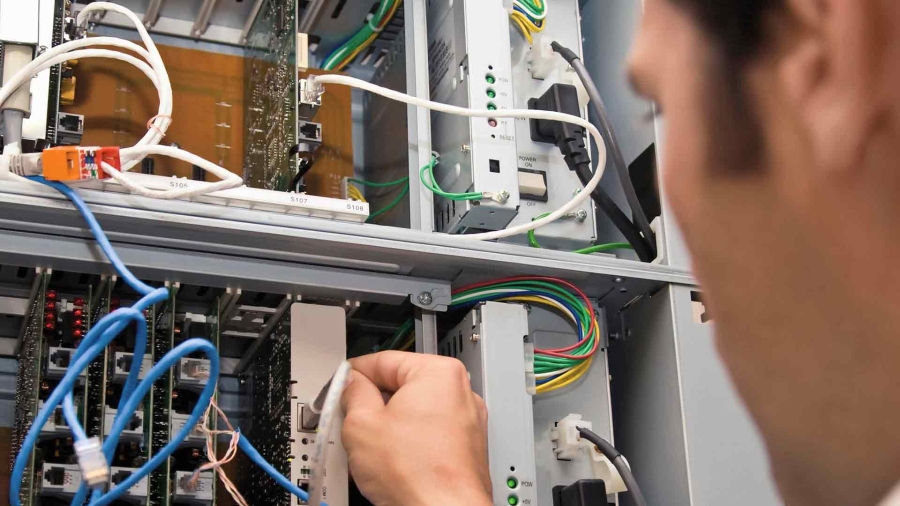 closeup shot of an electrician working with wires