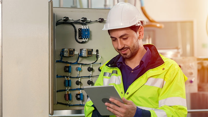 Engineer worker working checking maintenance electricity fuse box in and power line in factory