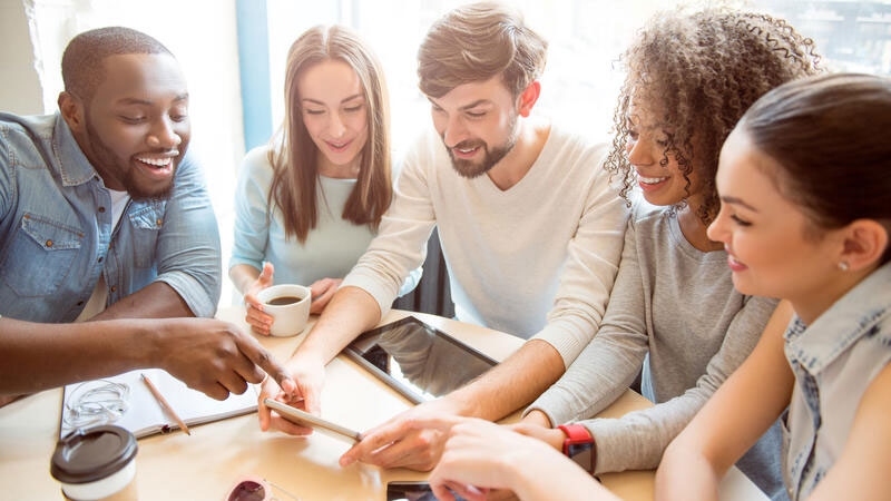 A group of people sitting at a table