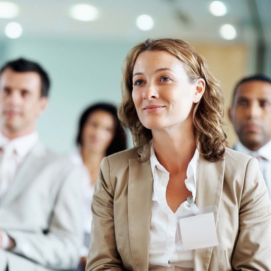 Closeup of a woman attending a training session along with other members