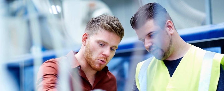 Young men working in manufacturing facility