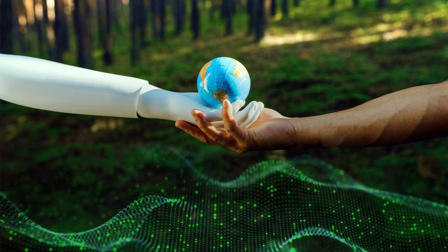 A person's hand reaching for a small globe