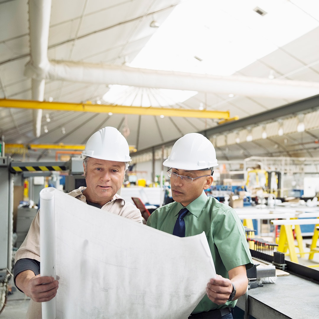 Two engineers working in factory