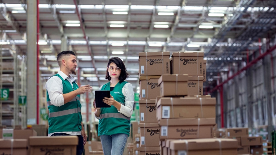 man and woman at a smart distribution center