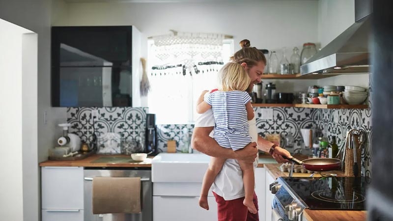 A person holding a child in his arms