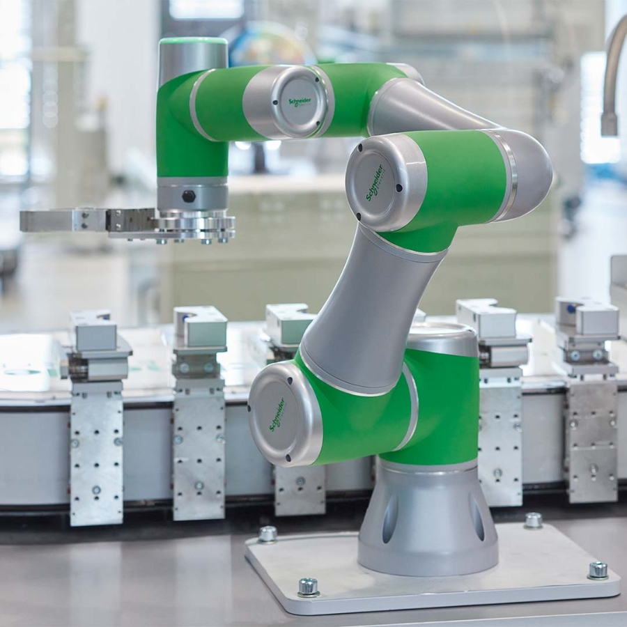 A green and grey robotic arm