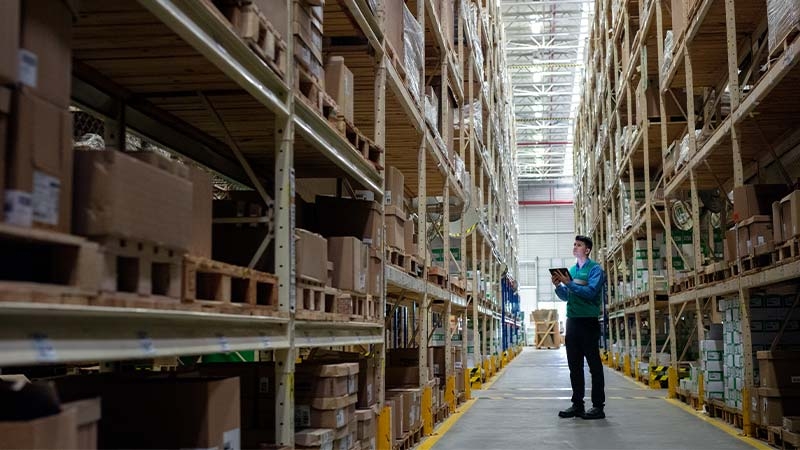 A person standing in a warehouse