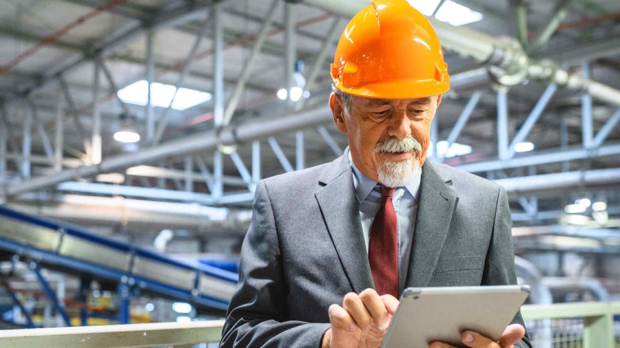 man using digital tablet in a facility