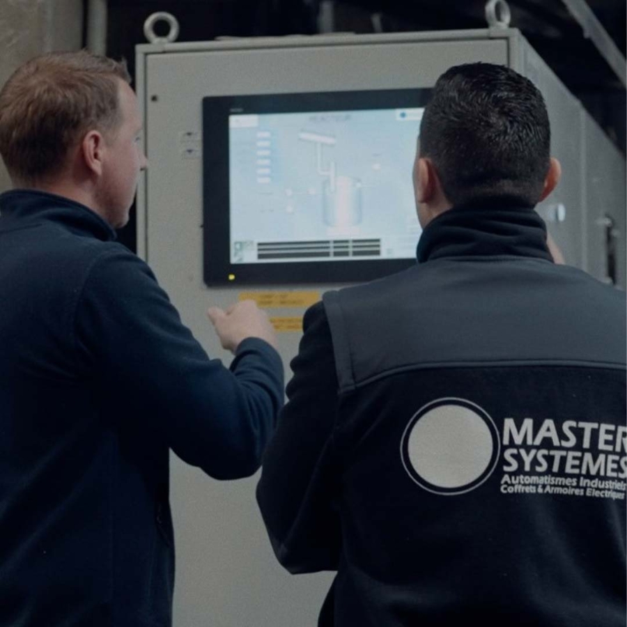 A group of men looking at a computer screen