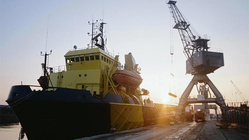 A large yellow ship in a port