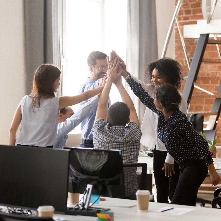 A group of people giving each other a high five