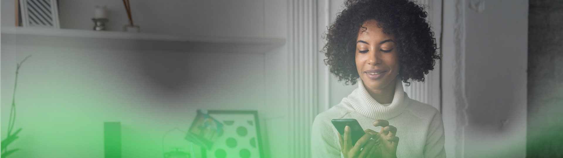 A woman with curly hairs using her phone