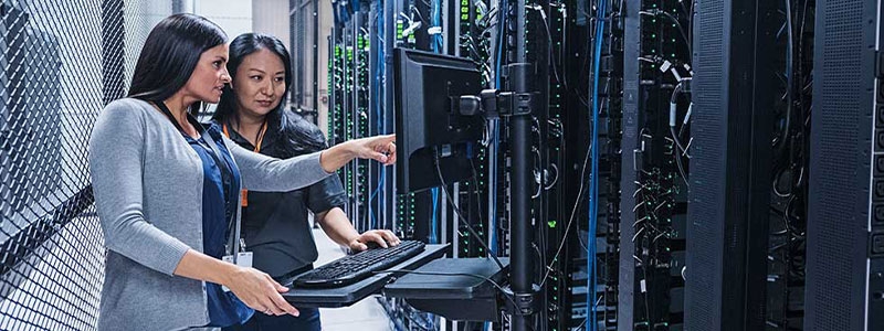 A person standing in a server room