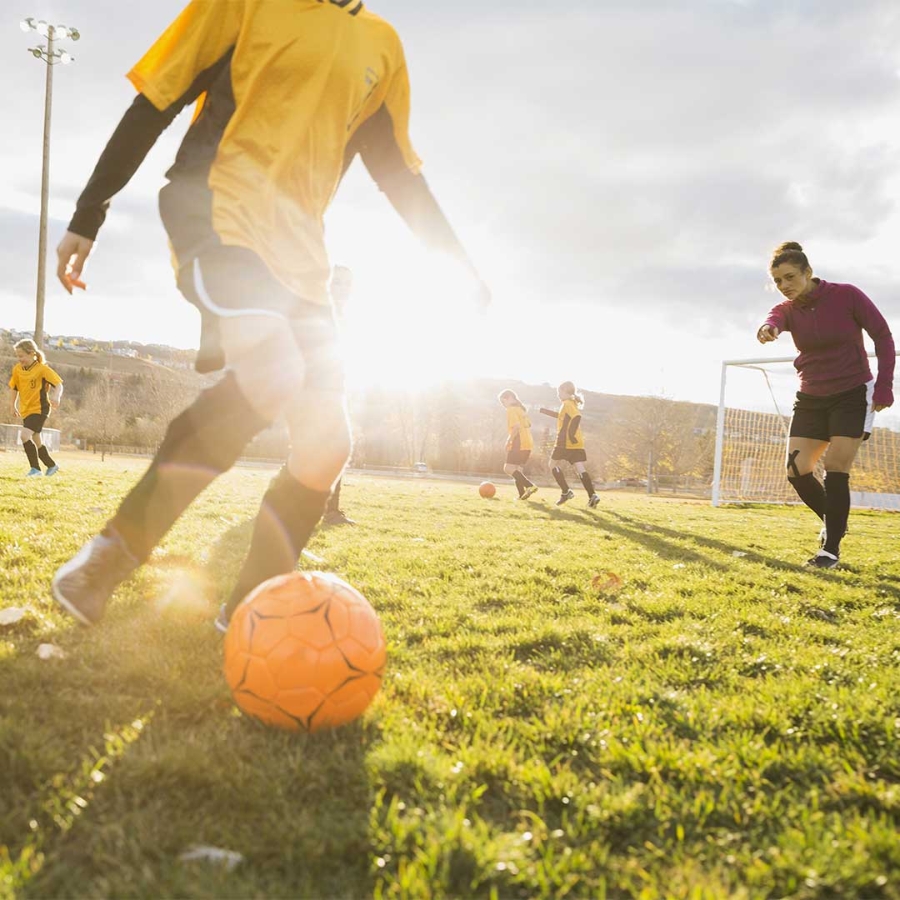 A group of people playing football