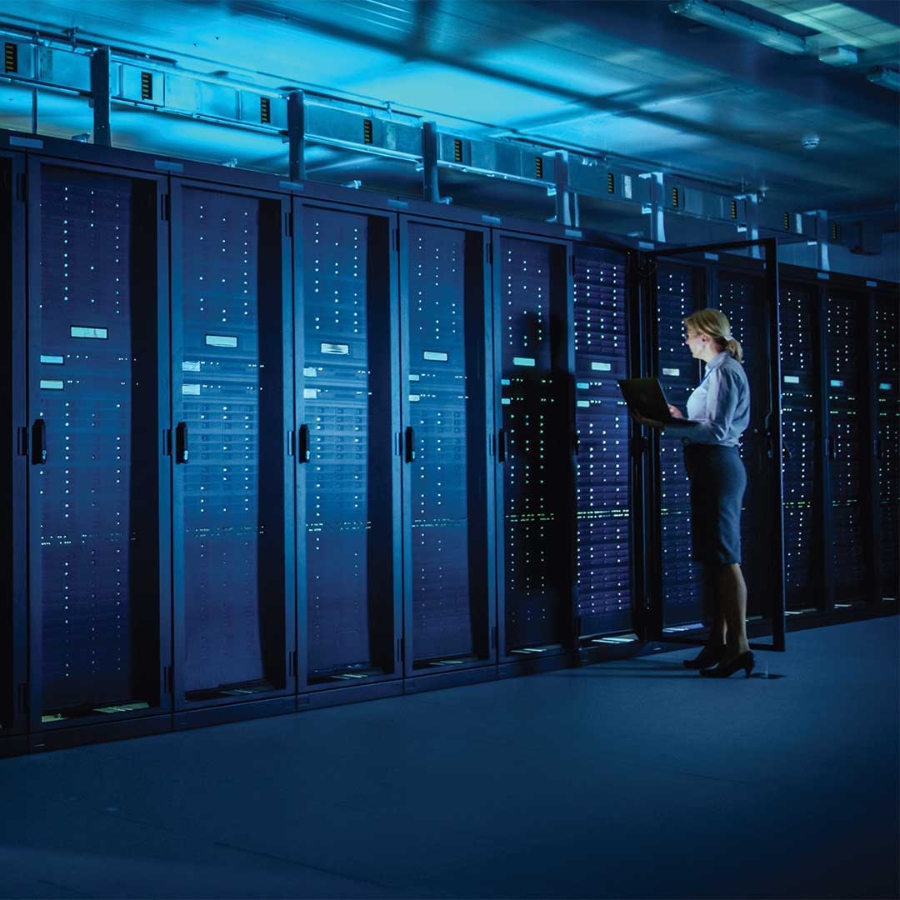 A person standing in a server room