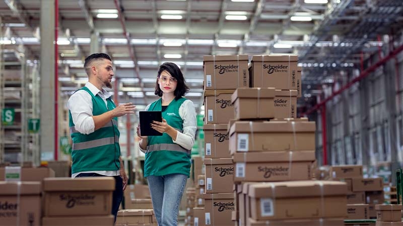 A person and person in a warehouse