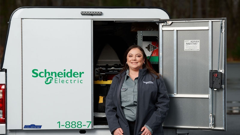 Image showing Schneider Electric employee Charlotte with her vehicle