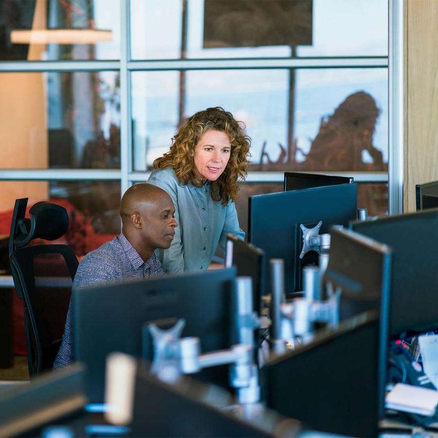 A person and person working on computers