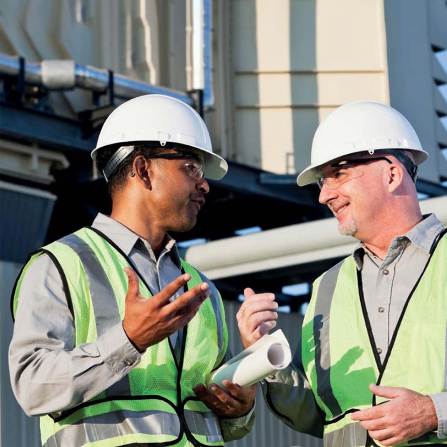 Two workers in factory