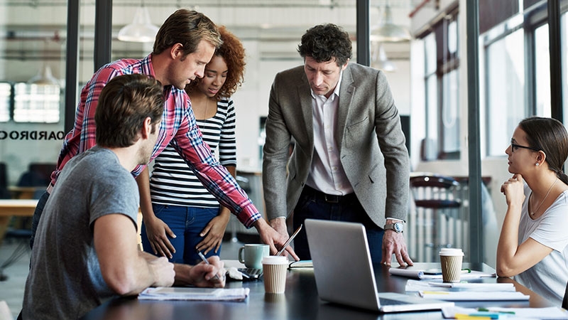 Employees discussing in office