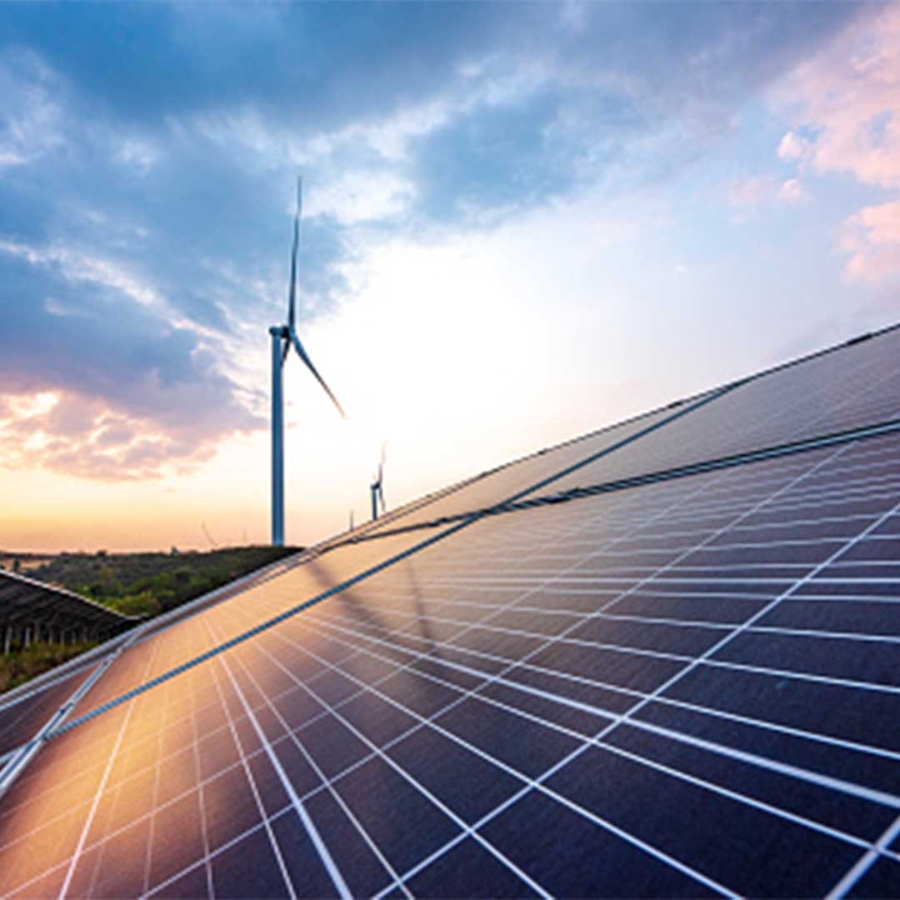 Solar panels and wind turbines in the background