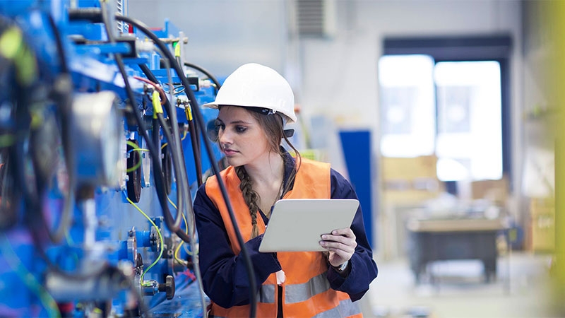 women engineering examining equipment