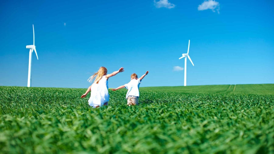 rear view of children experiencing nature with arms outstretched